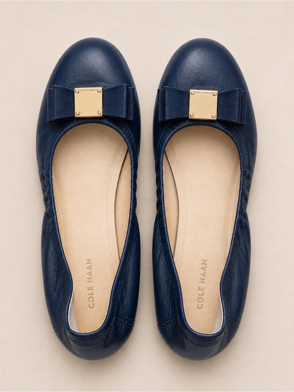 Cole Haan Navy Leather Vara Bow Flats with Gold Plaque